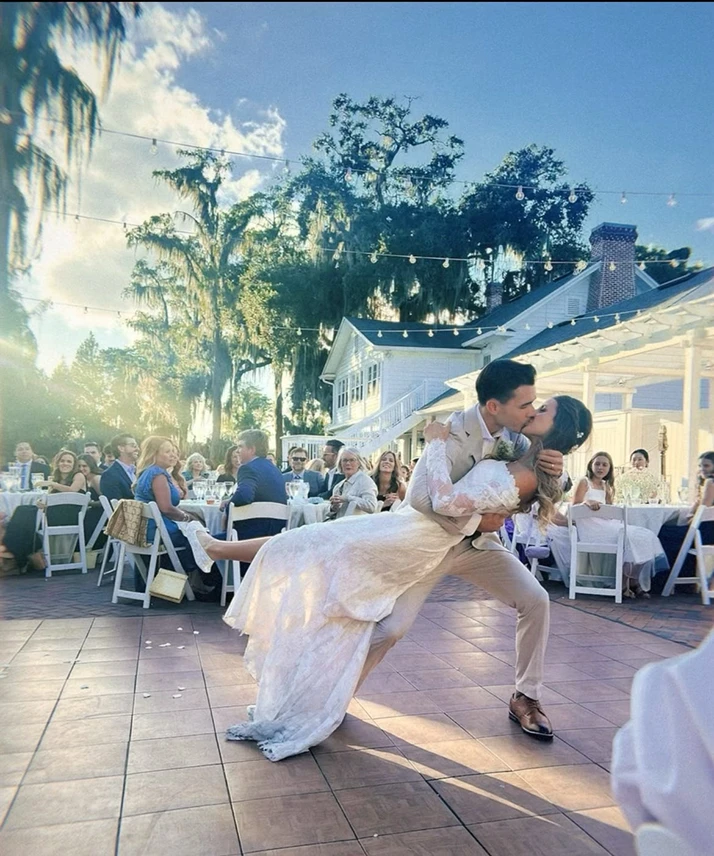 Chiropractic Torrance CA Groom Kissing Bride While Sweeping Her off Her Feet